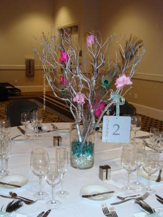 Silver Manzanita trees with crystals peacock feathers and bt pink gladiola