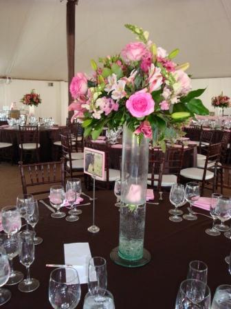 Her other centerpiece was 3 tall cylinder vases with brown ribbon around the 