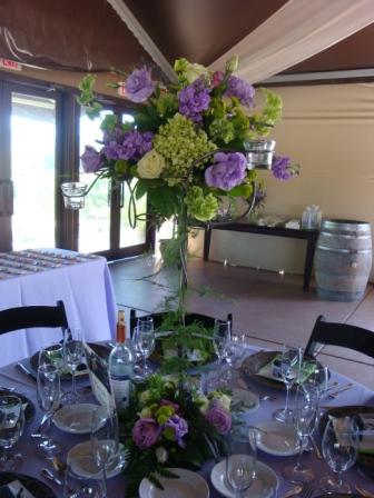 Lavender bright green arrangements of bells of Ireland hydrangea roses 