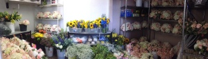 A look into our fridge with all the flowers ready to go.  The yellow & blue flowers are another wedding we had the same day.